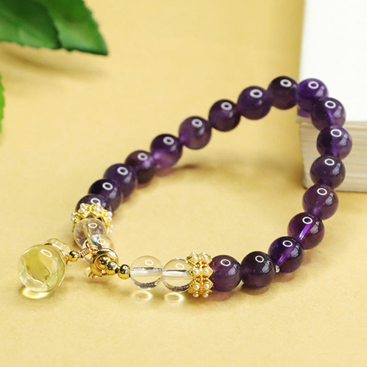 Pulsera de equilibrio con forma de bolsa de dinero de amatista y citrino natural de Buddha Stones