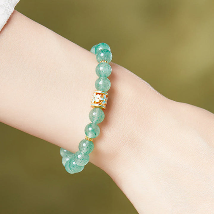Pulsera Buddha Stones de plata de ley 925 con cuarzo fresa verde y flor de la calma