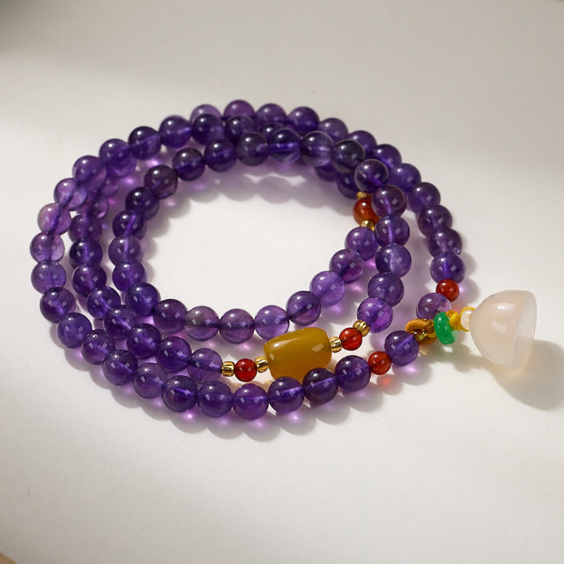 Pulsera multicapa con cuentas de amatista natural de Buddha Stones, colgante de moneda, calabaza, calcedonia y loto.