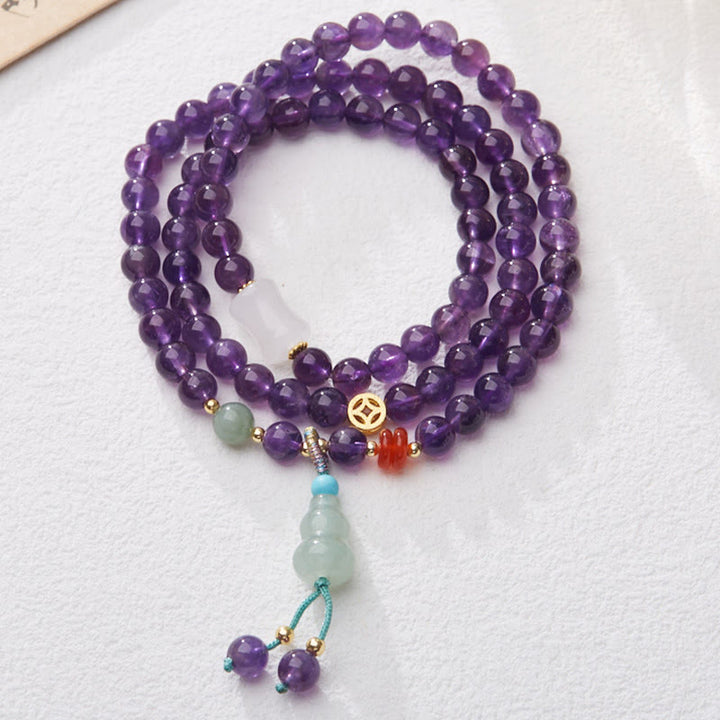 Pulsera multicapa con cuentas de amatista natural de Buddha Stones, colgante de moneda, calabaza, calcedonia y loto.