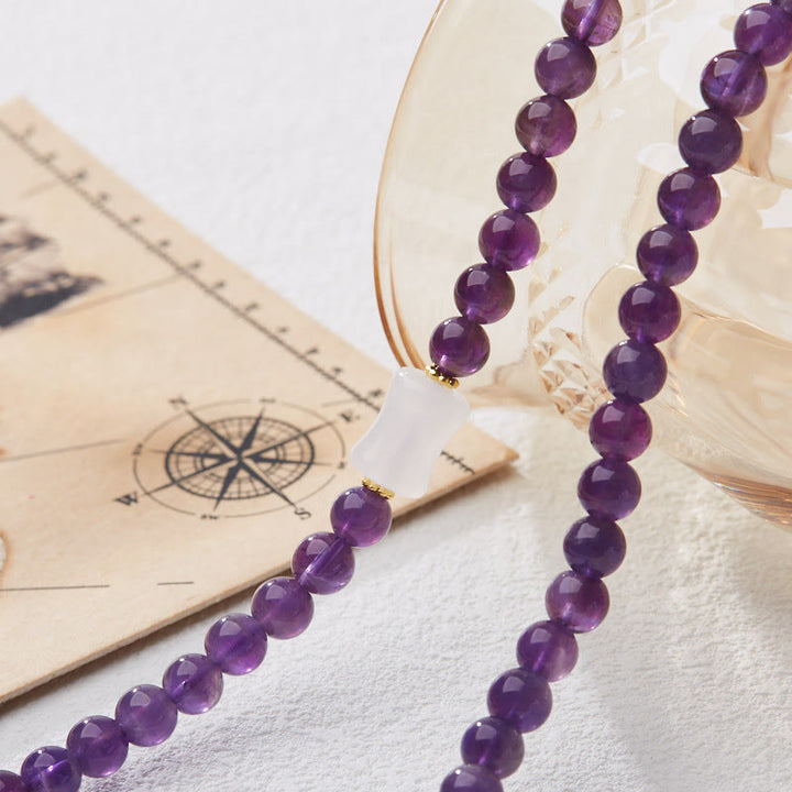Pulsera multicapa con cuentas de amatista natural de Buddha Stones, colgante de moneda, calabaza, calcedonia y loto.
