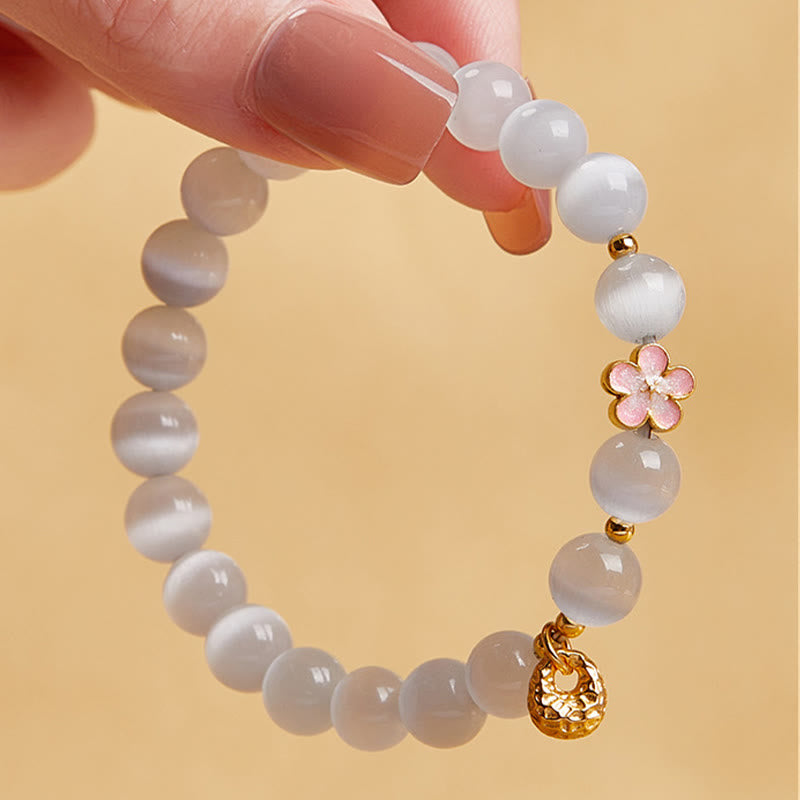 Pulsera con Buddha Stones en plata de ley 925 con flor de melocotón natural y ojo de gato blanco
