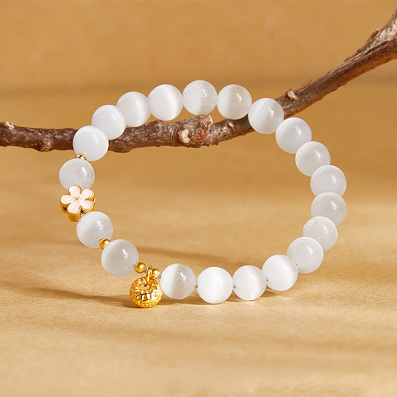 Pulsera con Buddha Stones en plata de ley 925 con flor de melocotón natural y ojo de gato blanco