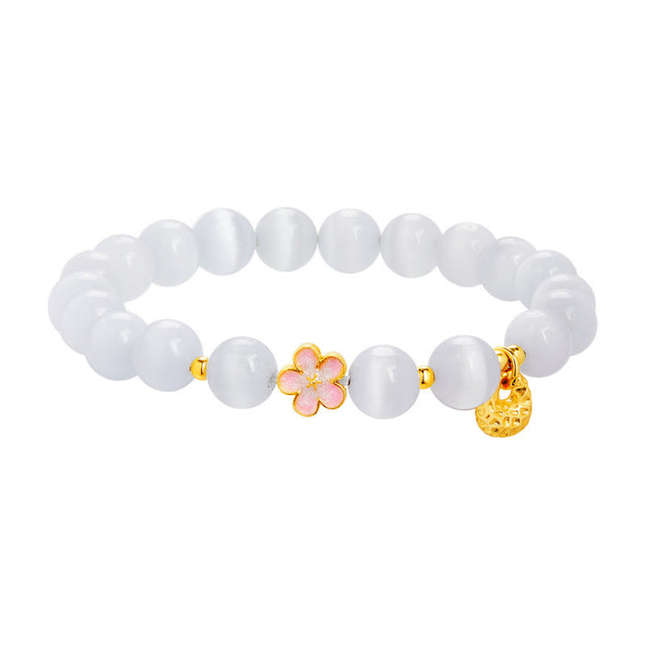 Pulsera con Buddha Stones en plata de ley 925 con flor de melocotón natural y ojo de gato blanco