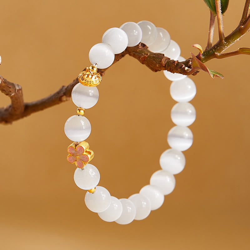 Pulsera con Buddha Stones en plata de ley 925 con flor de melocotón natural y ojo de gato blanco