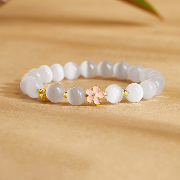 Pulsera con Buddha Stones en plata de ley 925 con flor de melocotón natural y ojo de gato blanco