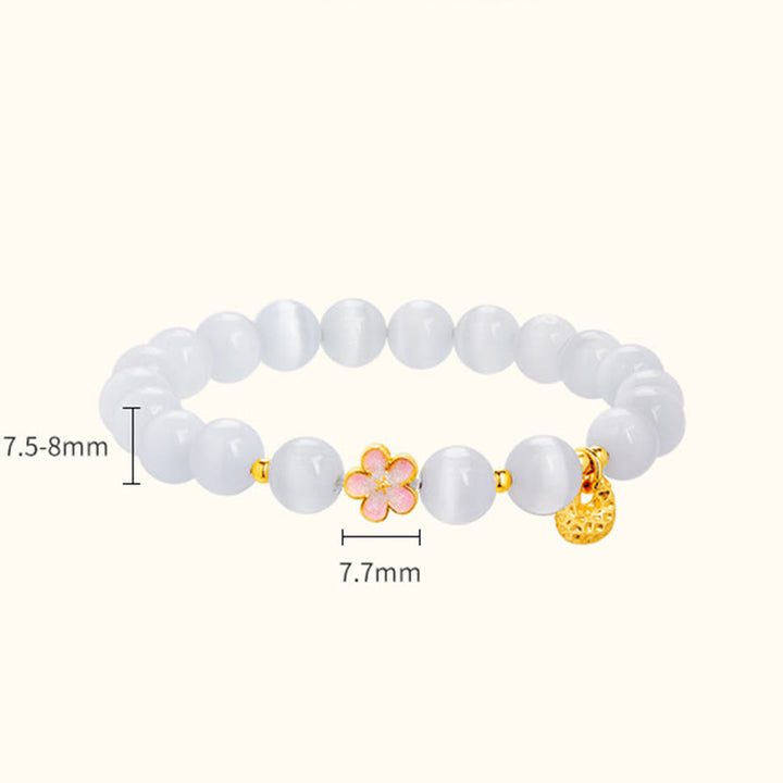 Pulsera con Buddha Stones en plata de ley 925 con flor de melocotón natural y ojo de gato blanco