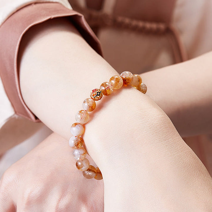 Pulsera protectora de cuentas de citrino natural con forma de flor de Buddha Stones 999