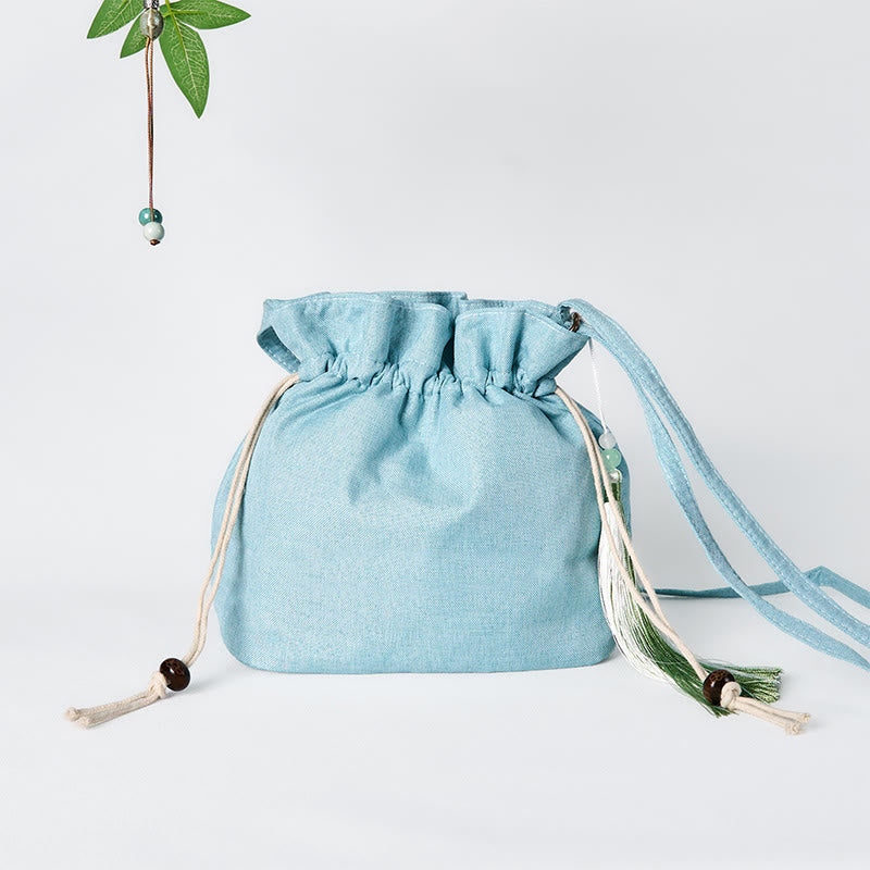 Bolso bandolera de lino y algodón de bambú verde con bordado de Buddha Stones