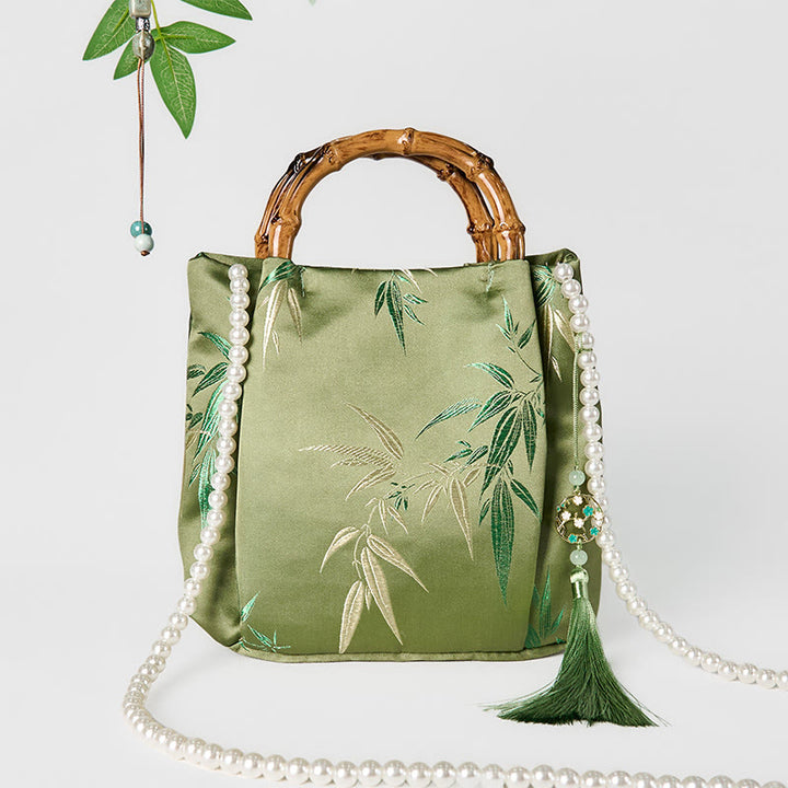 Bolso bandolera con asa de bambú y perlas, con bordado de hojas y Buddha Stones