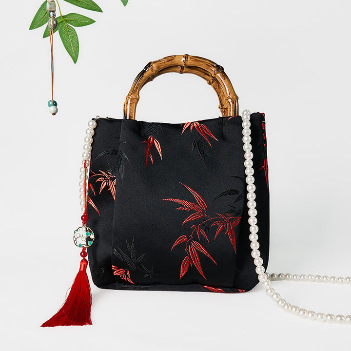 Bolso bandolera con Buddha Stones y asa de bambú y perlas.