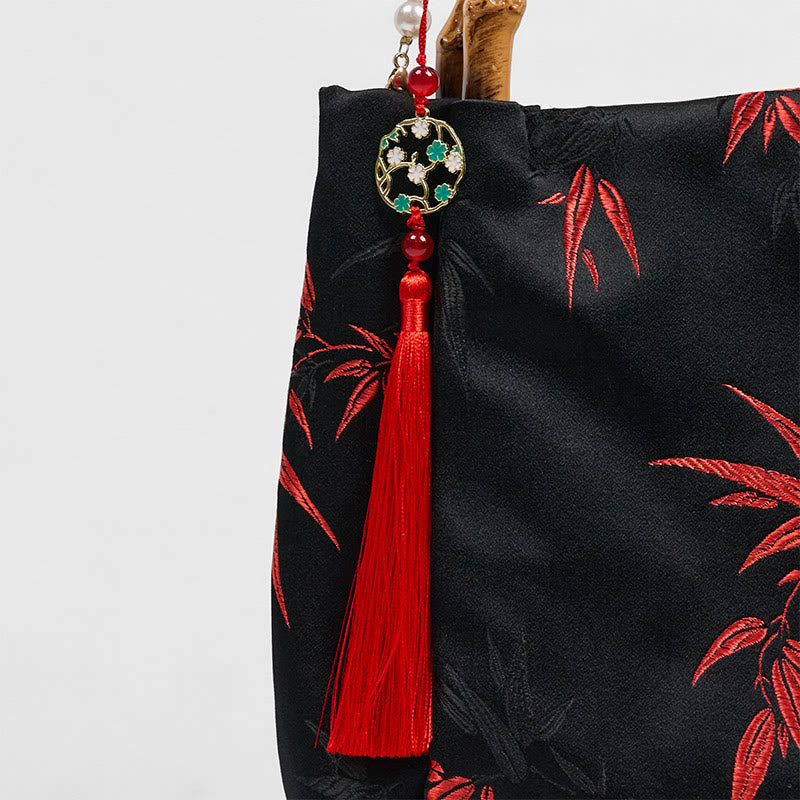 Bolso bandolera con Buddha Stones y asa de bambú y perlas.