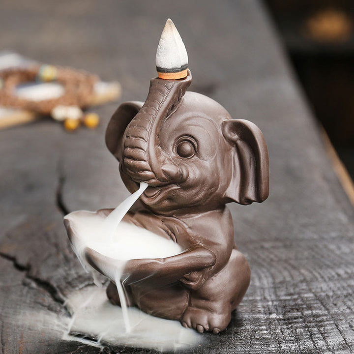 Quemador de incienso curativo con fuente de humo de reflujo de arcilla morada con diseño de elefante pequeño sosteniendo una Buddha Stones - image 3