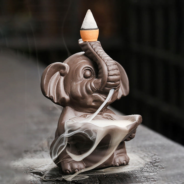 Quemador de incienso curativo con fuente de humo de reflujo de arcilla morada con diseño de elefante pequeño sosteniendo una Buddha Stones - image 2