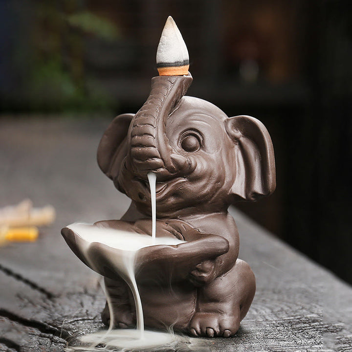 Quemador de incienso curativo con fuente de humo de reflujo de arcilla morada con diseño de elefante pequeño sosteniendo una Buddha Stones - image 4