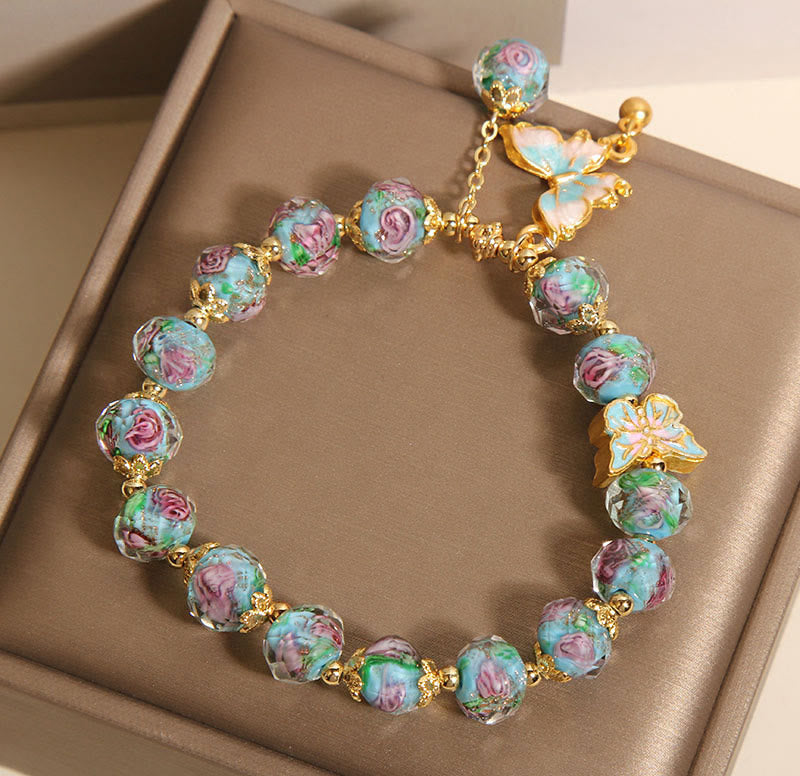 Pulsera Liuli con dije de mariposa y flor rosa de Buddha Stones - image 7