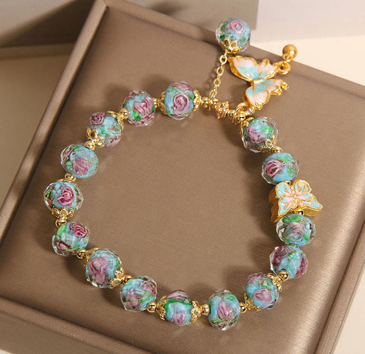 Pulsera Liuli con dije de mariposa y flor rosa de Buddha Stones - image 7