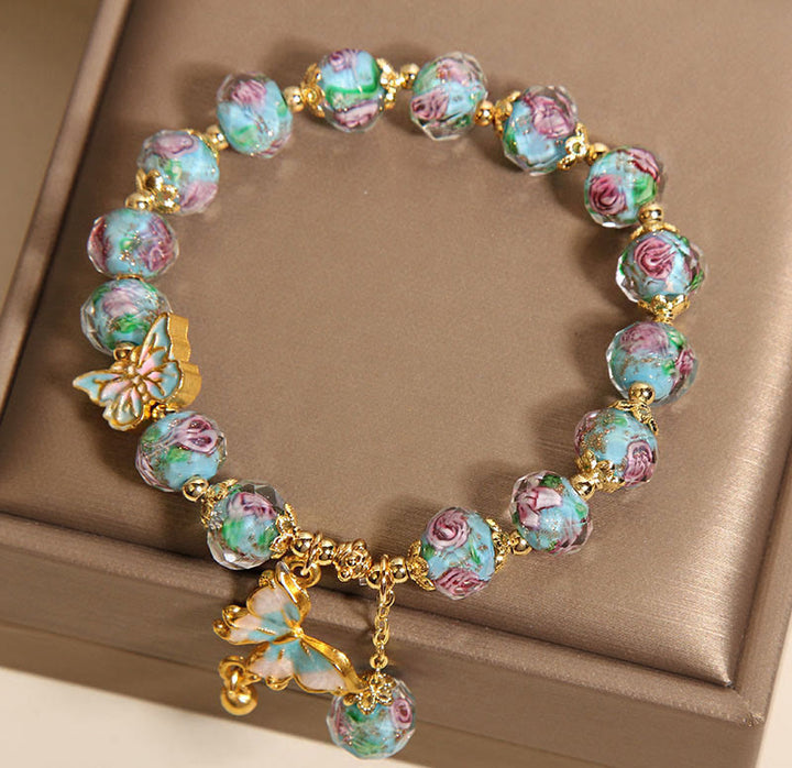 Pulsera Liuli con dije de mariposa y flor rosa de Buddha Stones - image 6