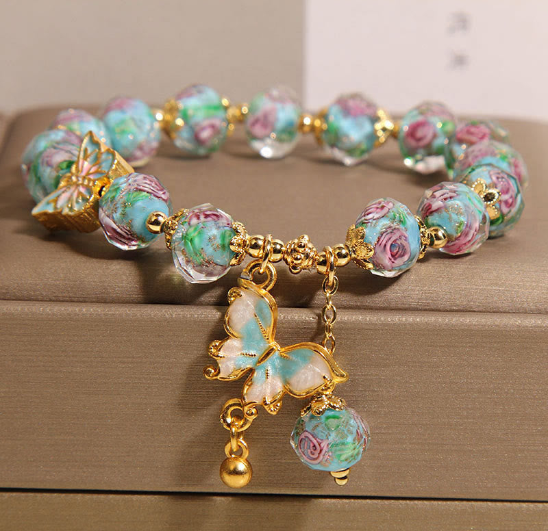 Pulsera Liuli con dije de mariposa y flor rosa de Buddha Stones - Liuli azul (circunferencia de la muñeca: 18 cm) - image 1