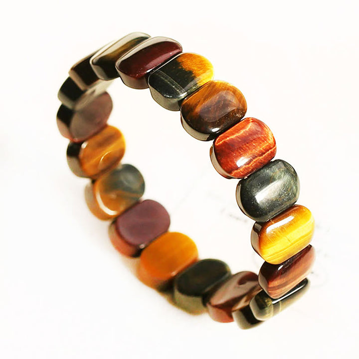 Pulsera de fuerza con cuentas ovaladas de ojo de tigre de colores naturales de Buddha Stones