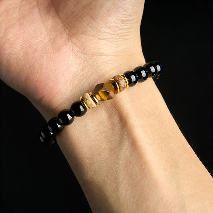 Pulsera purificadora seccional con cuentas de obsidiana negra y ojo de tigre de Buddha Stones
