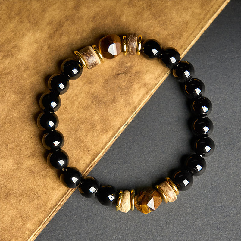 Pulsera purificadora seccional con cuentas de obsidiana negra y ojo de tigre de Buddha Stones
