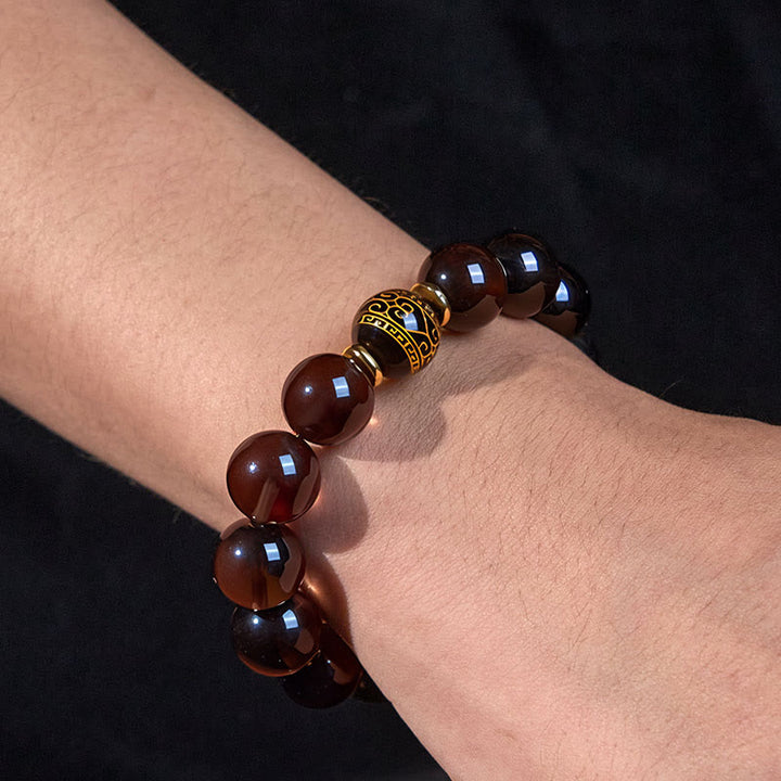 Pulsera de coraje en sánscrito con obsidiana de hielo y Buddha Stones con sello dorado