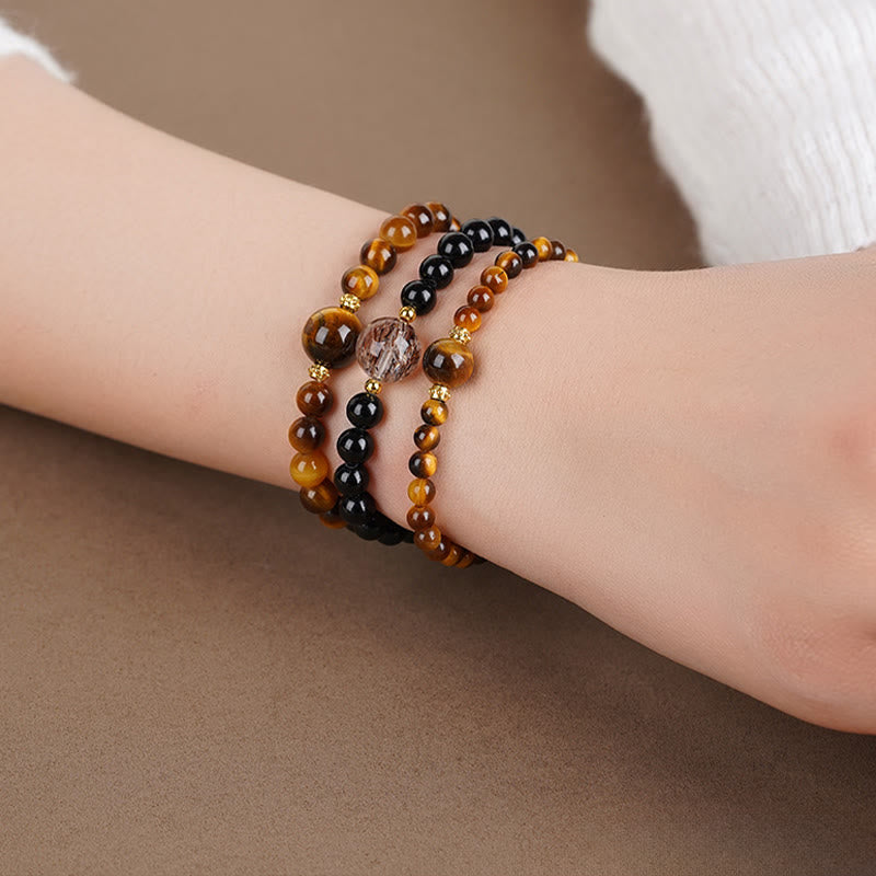 Pulsera de cuentas de coraje de obsidiana negra y ojo de tigre de Buddha Stones - image 5