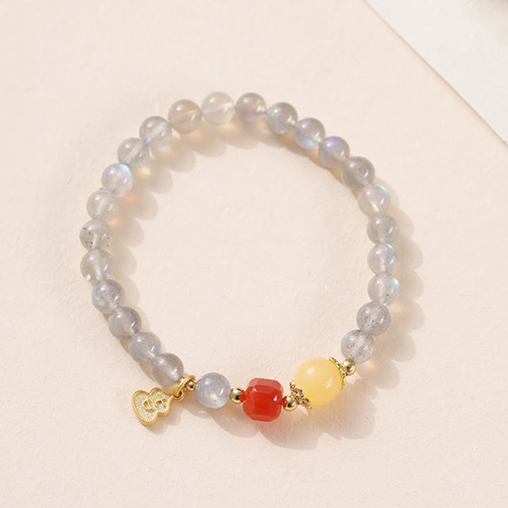 Pulsera con encanto de loto, piedra lunar natural y Buddha Stones - image 11