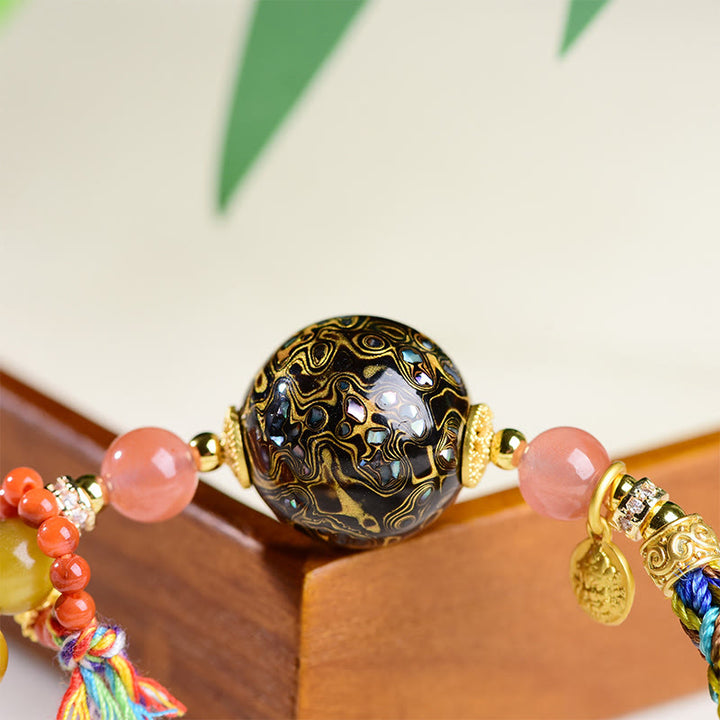Pulsera de protección de ojo de tigre tejida a mano con cuentas de laca tibetana de Buddha Stones - image 10