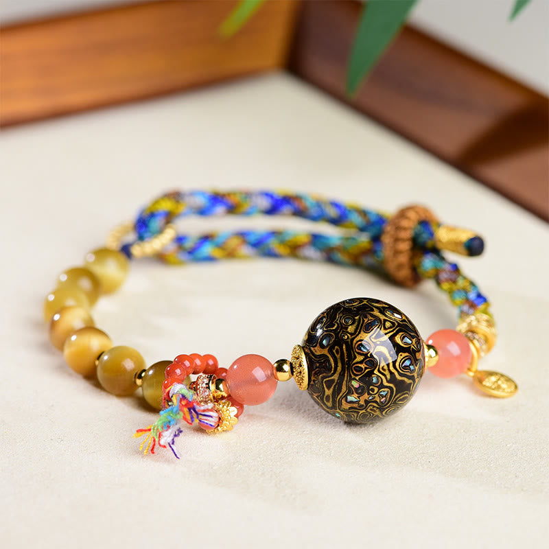 Pulsera de protección de ojo de tigre tejida a mano con cuentas de laca tibetana de Buddha Stones - image 1