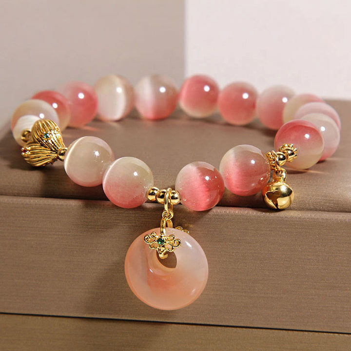 Pulsera de la paz con Buddha Stones y ágata Yanyuan de ojo de gato rosa degradado con hebilla de paz natural - image 1
