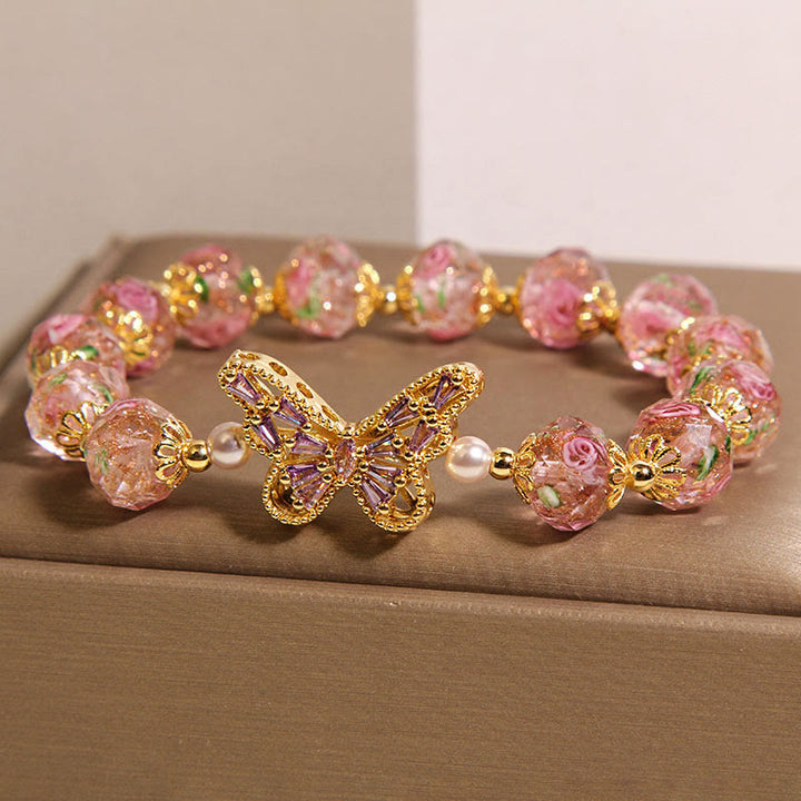 Pulsera de cristal rosa cálido con diseño de mariposa natural y Buddha Stones - image 1