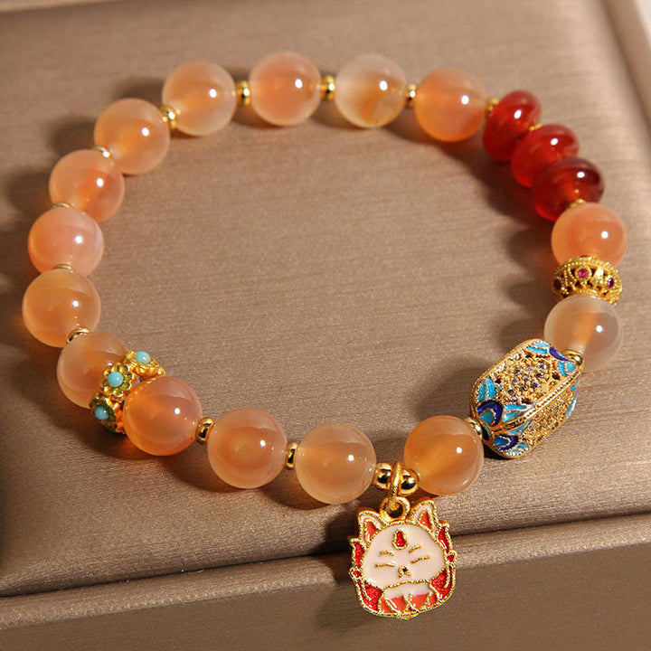 Pulsera curativa de ágata naranja y caramelo con zorro de nueve colas de Buddha Stones - image 6