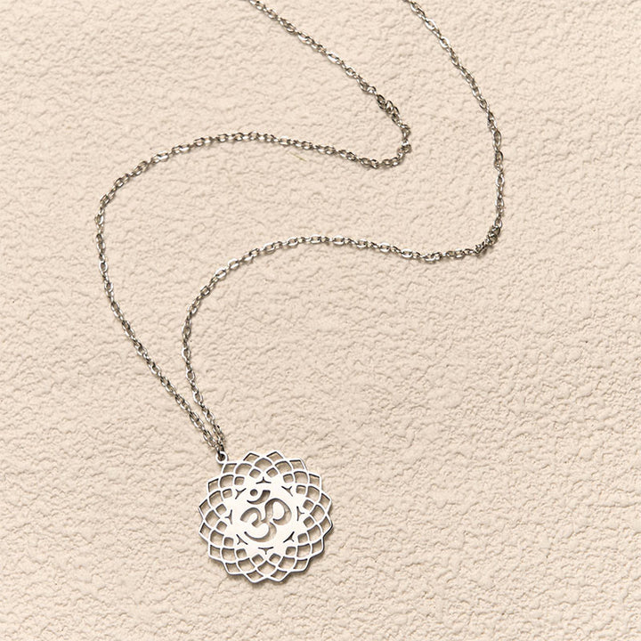 Collar con colgante de acero inoxidable con símbolo Om y diseño de loto hueco de Buddha Stones - image 12