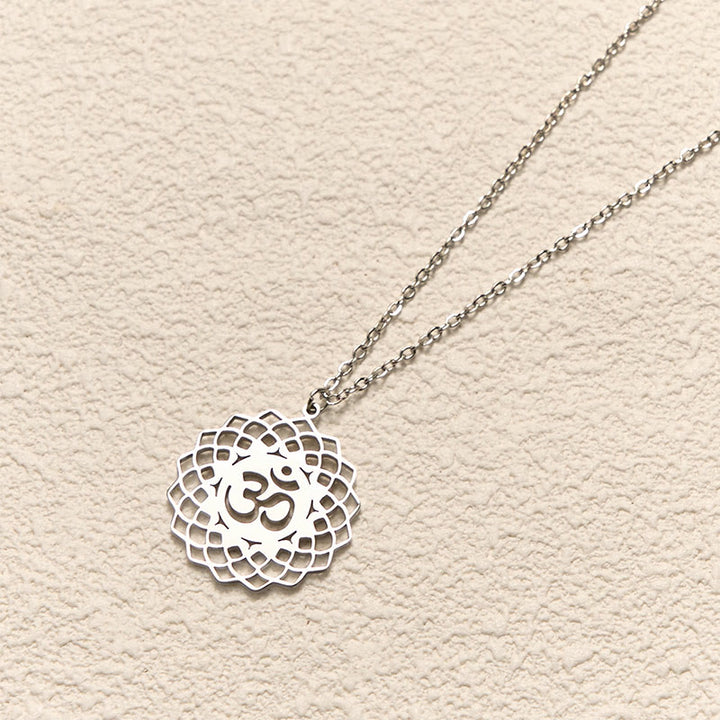 Collar con colgante de acero inoxidable con símbolo Om y diseño de loto hueco de Buddha Stones - image 11