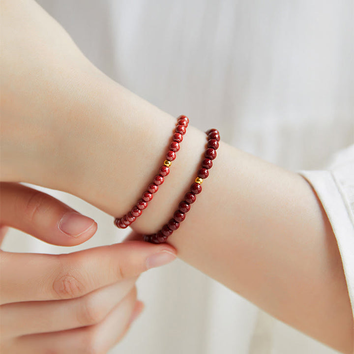 Pulsera de concentración con diseño simple de cinabrio y oro 999 de Buddha Stones - image 17