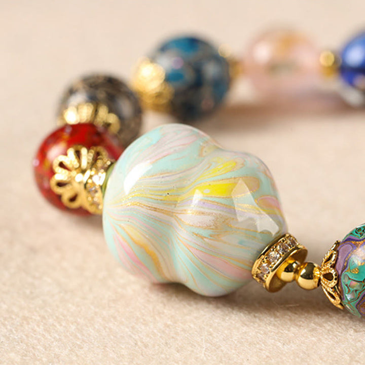 Pulsera artesanal lacada con cuentas de calabaza, sándalo, vidrio y Buddha Stones de colores de Liuli. - image 13