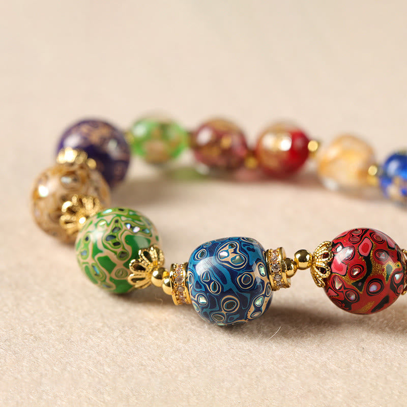 Pulsera artesanal lacada con cuentas de calabaza, sándalo, vidrio y Buddha Stones de colores de Liuli. - image 2