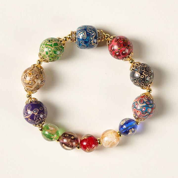 Pulsera artesanal lacada con cuentas de calabaza, sándalo, vidrio y Buddha Stones de colores de Liuli. - 12 mm - image 0