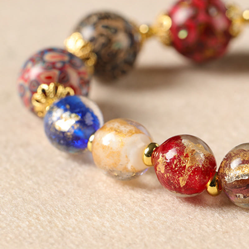 Pulsera artesanal lacada con cuentas de calabaza, sándalo, vidrio y Buddha Stones de colores de Liuli. - image 3