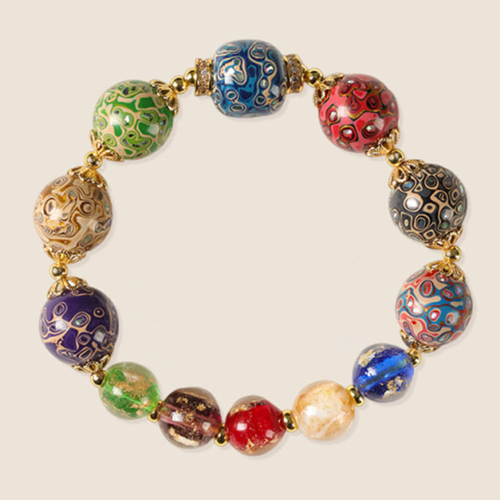 Pulsera artesanal lacada con cuentas de calabaza, sándalo, vidrio y Buddha Stones de colores de Liuli. - image 6