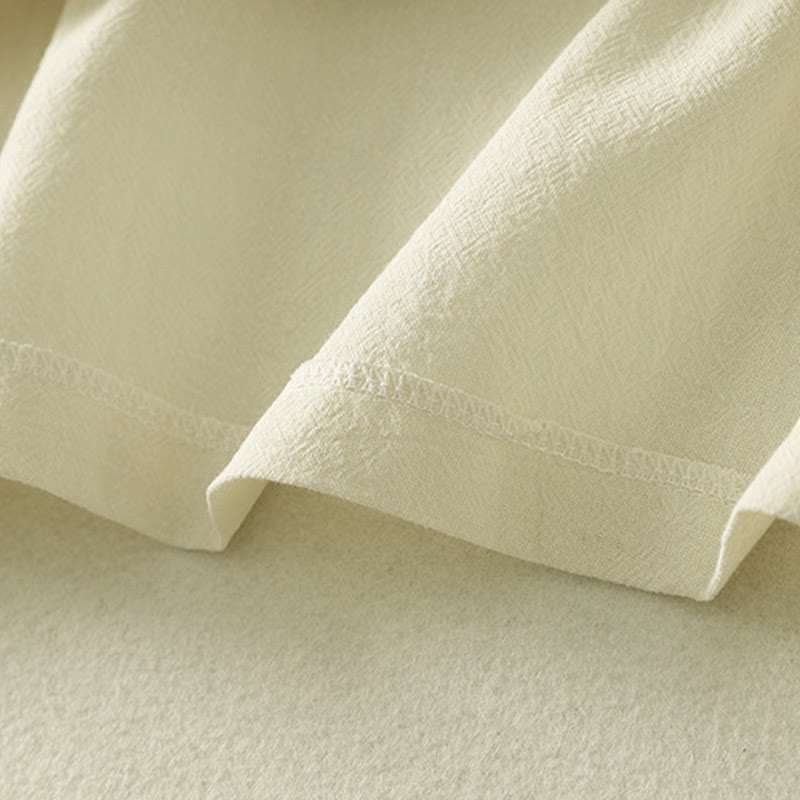 Camisa de algodón de manga larga para mujer con botones asimétricos y estampado de Buddha Stones en la parte delantera. - image 15