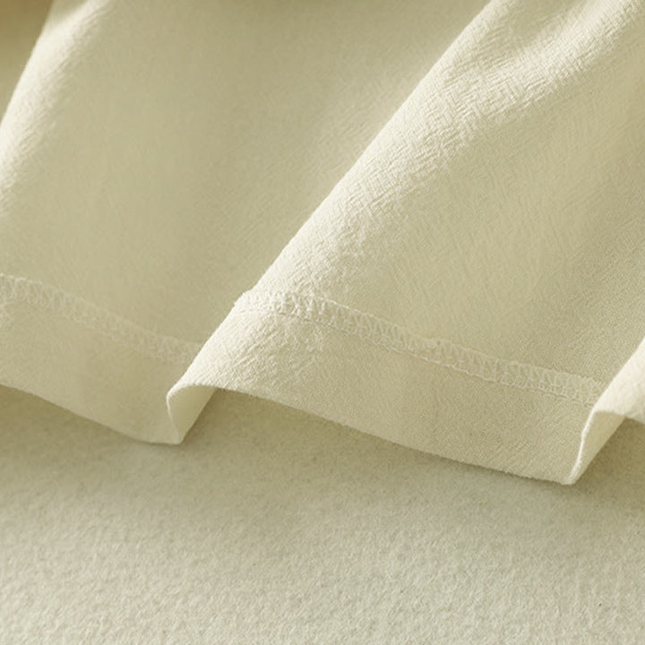 Camisa de algodón de manga larga para mujer con botones asimétricos y estampado de Buddha Stones en la parte delantera. - image 15