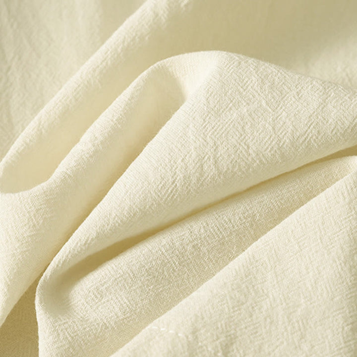 Camisa de algodón de manga larga para mujer con botones asimétricos y estampado de Buddha Stones en la parte delantera. - image 12