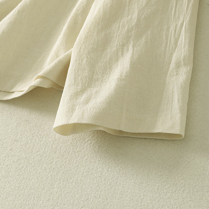 Camisa de algodón de manga larga para mujer con botones asimétricos y estampado de Buddha Stones en la parte delantera. - image 13