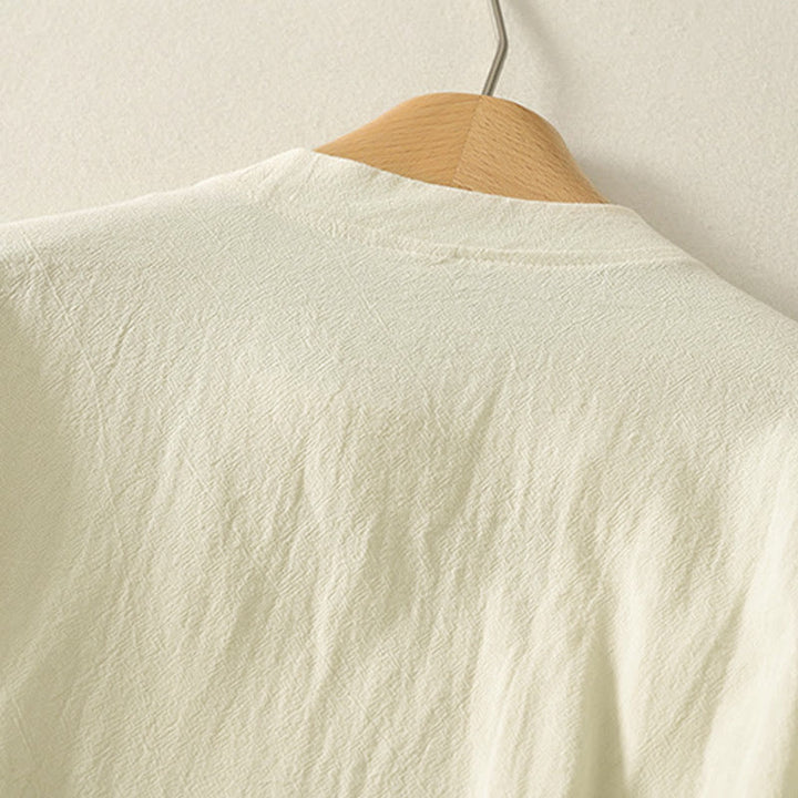 Camisa de algodón de manga larga para mujer con botones asimétricos y estampado de Buddha Stones en la parte delantera. - image 9