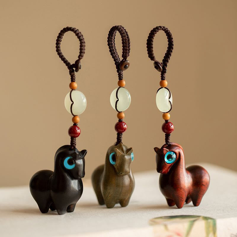 Buddha Stones Año del Caballo Hoja pequeña Sándalo rojo Sándalo verde Madera de ébano Llavero de calma - image 1