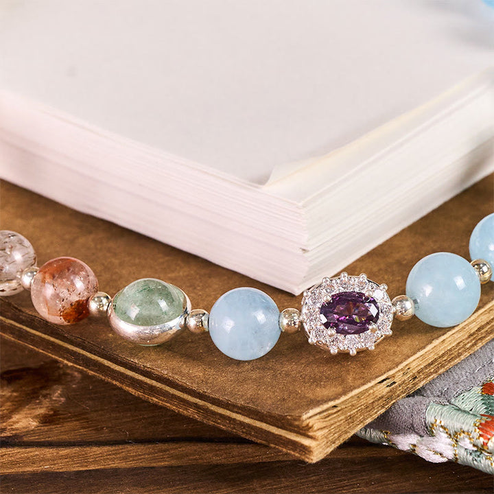 Llavero colgante para teléfono con Buddha Stones de calcedonia azul de 8 mm y siete cristales energéticos. - image 1