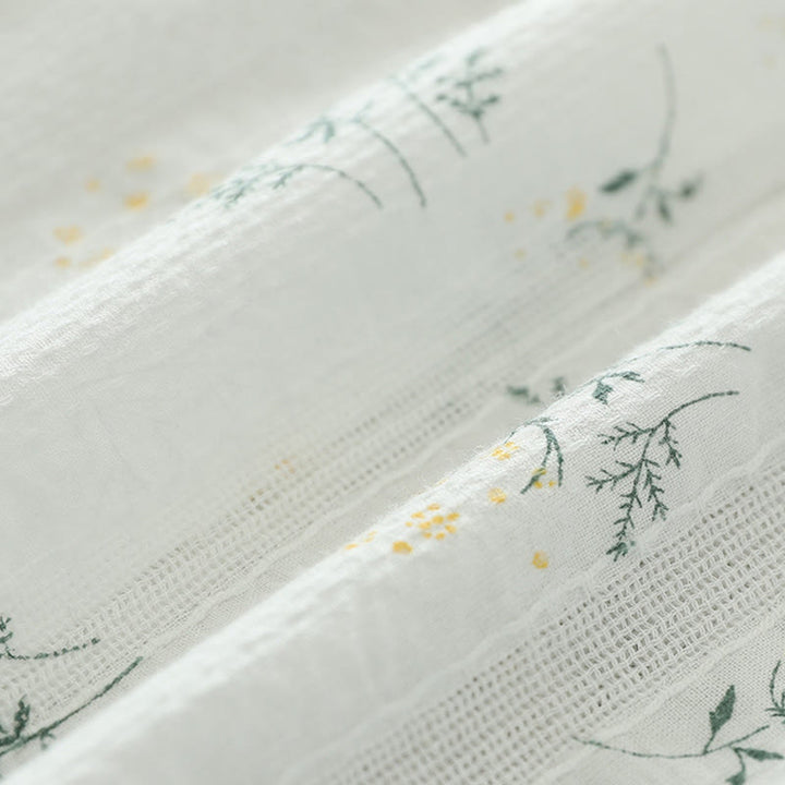 Camisa de manga larga de algodón para mujer con estampado de Buddha Stones, flores blancas y amarillas, hojas verdes y botones. - image 10